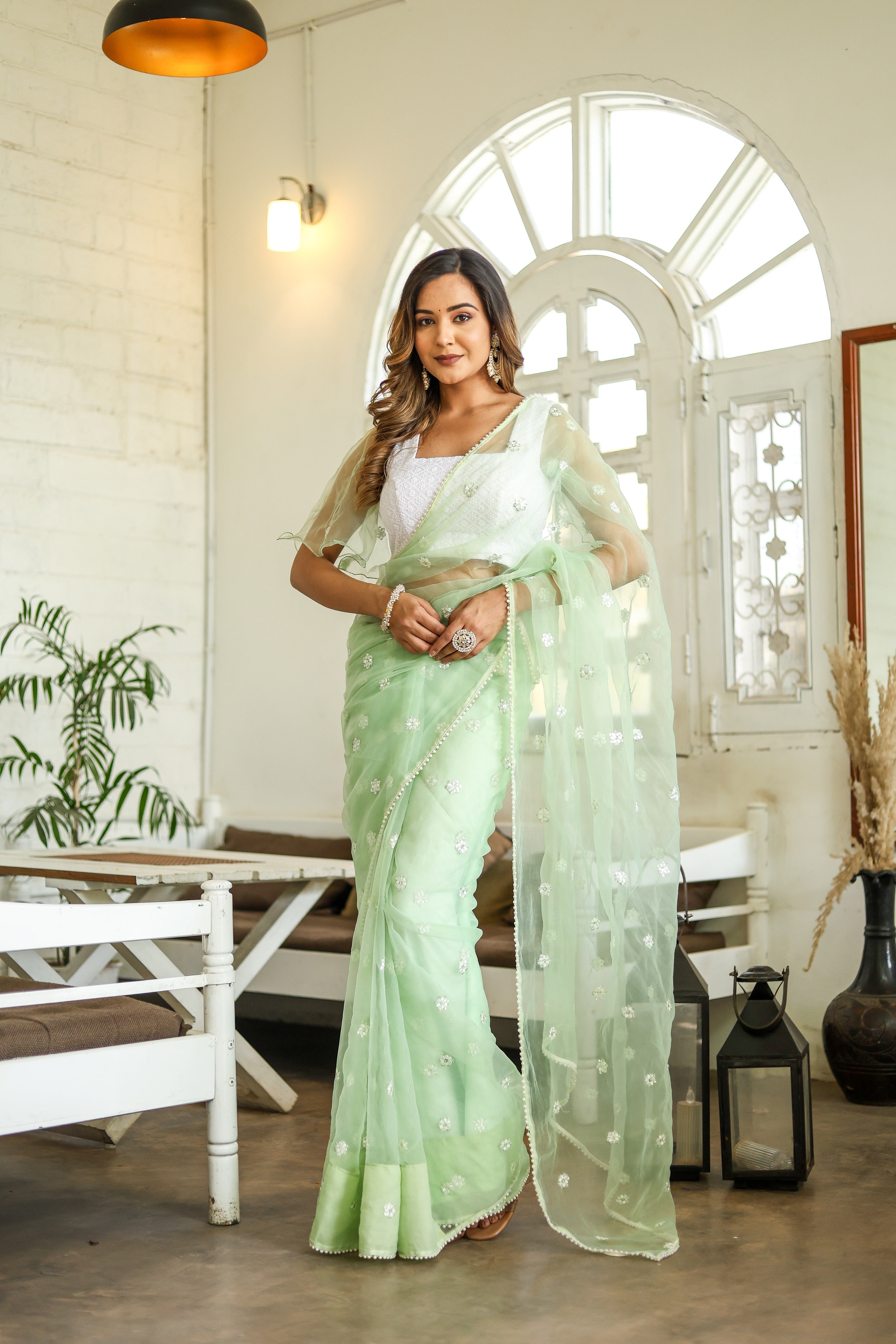 Emerald Enchantment (Embroidered Buttis Organza Pastel Green Saree)