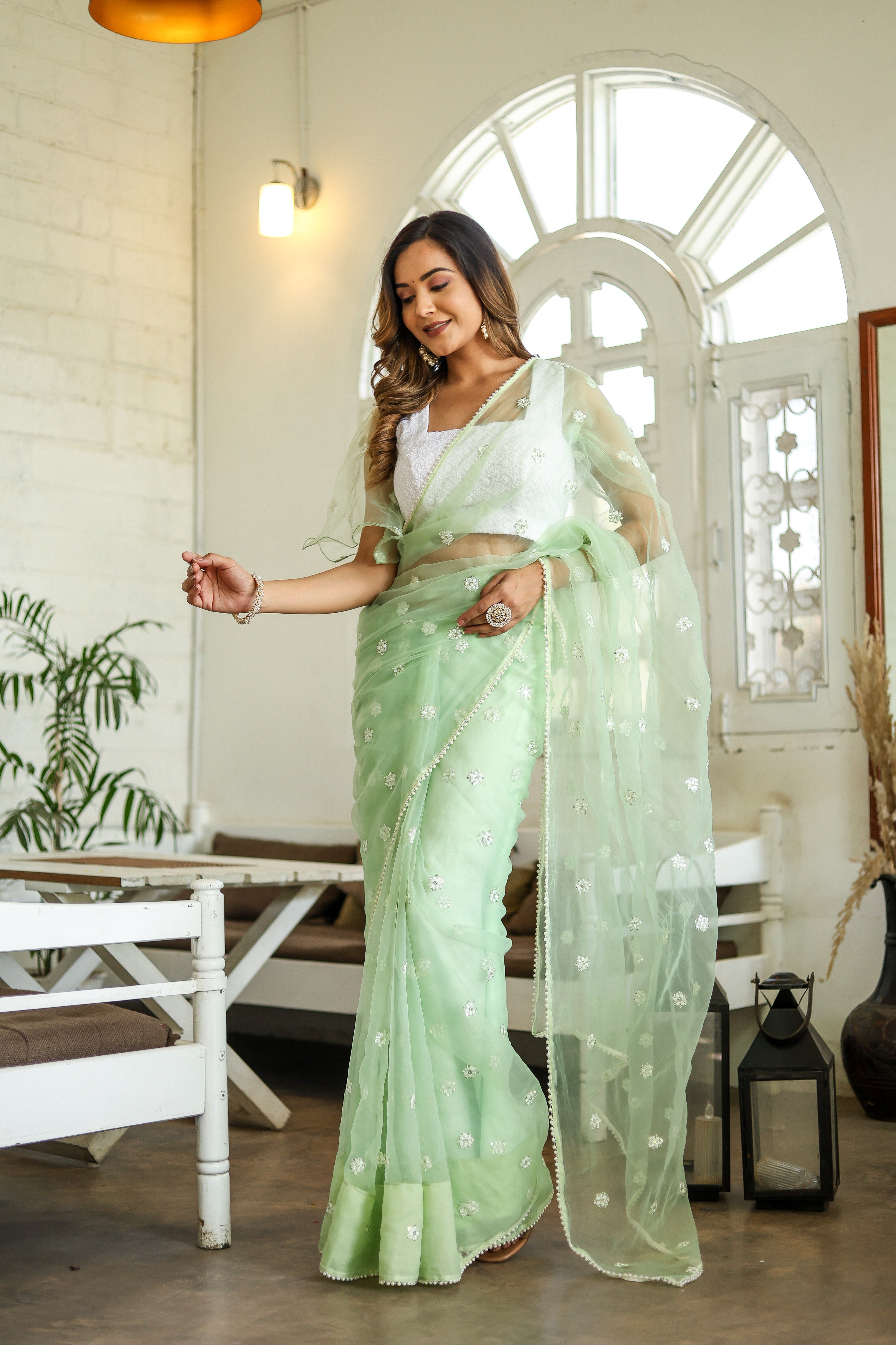 Emerald Enchantment (Embroidered Buttis Organza Pastel Green Saree)