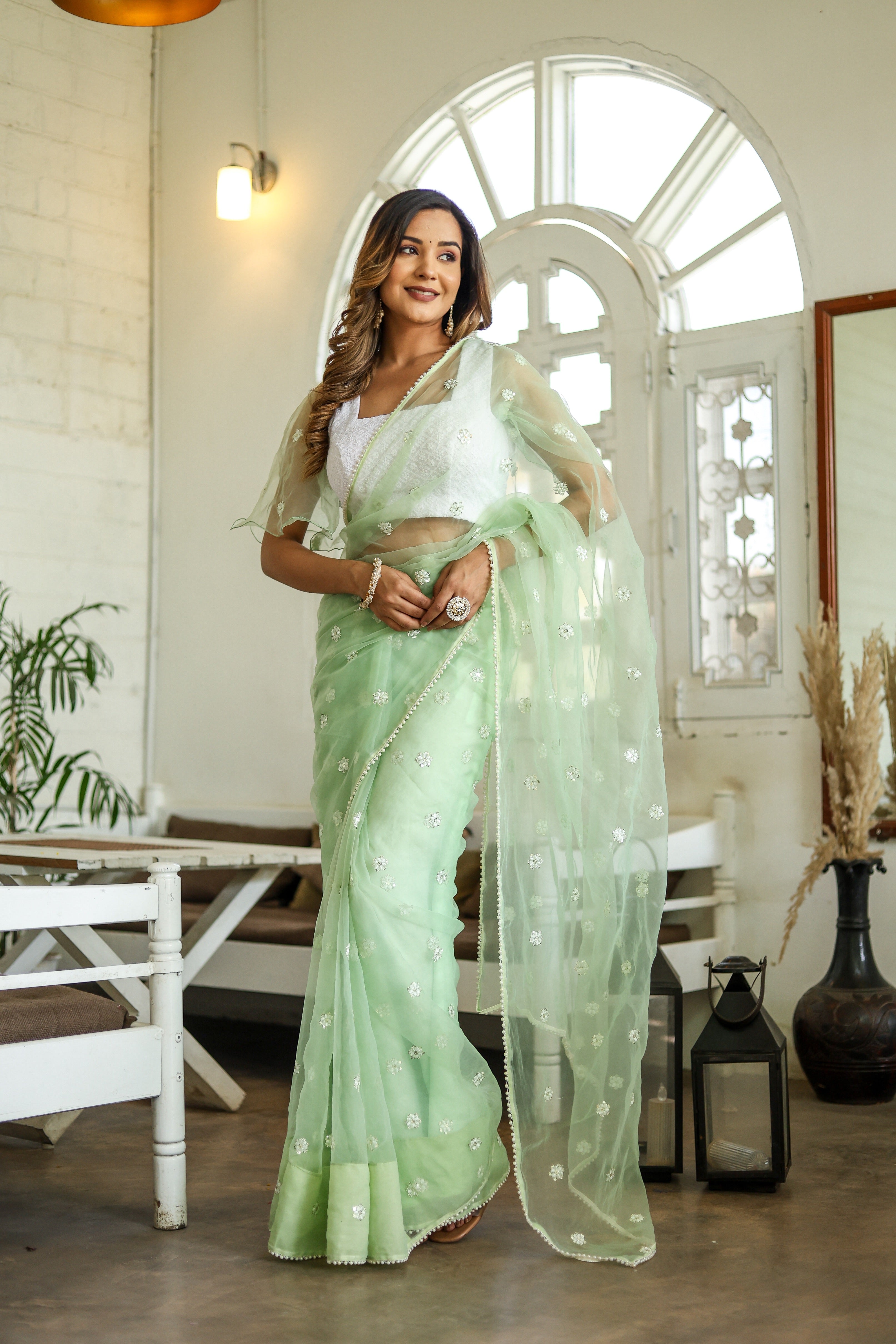 Emerald Enchantment (Embroidered Buttis Organza Pastel Green Saree)