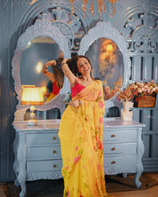 Golden Bloom Reverie (Handpainted pure viscose yellow chiffon saree with sequins work)