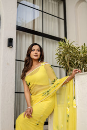 Sunlit Bloom (Handpainted pure viscose chiffon saree with pearl border)