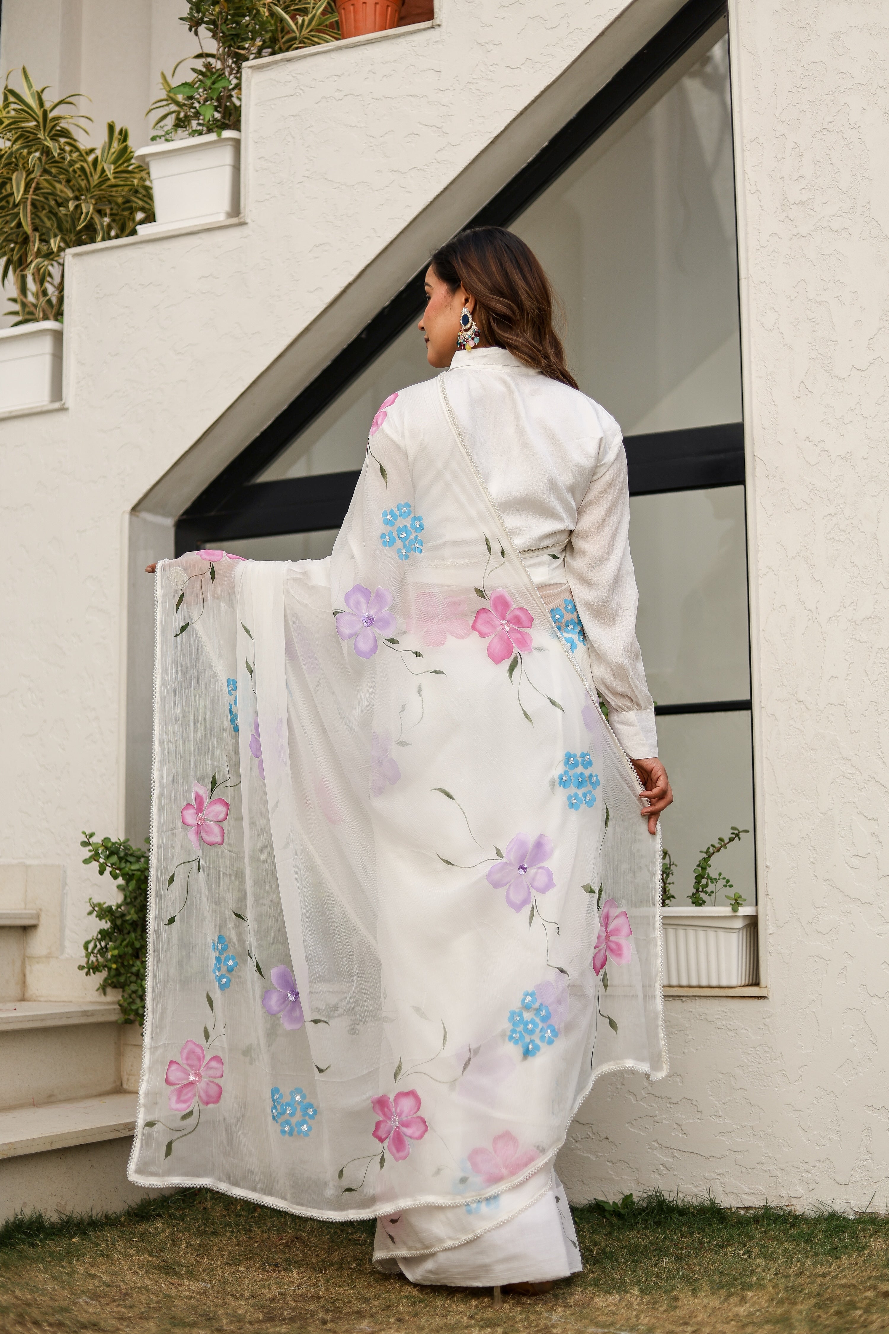 Moonlit Florals (Handpainted pure viscose chiffon saree with sequins work and pearl border)
