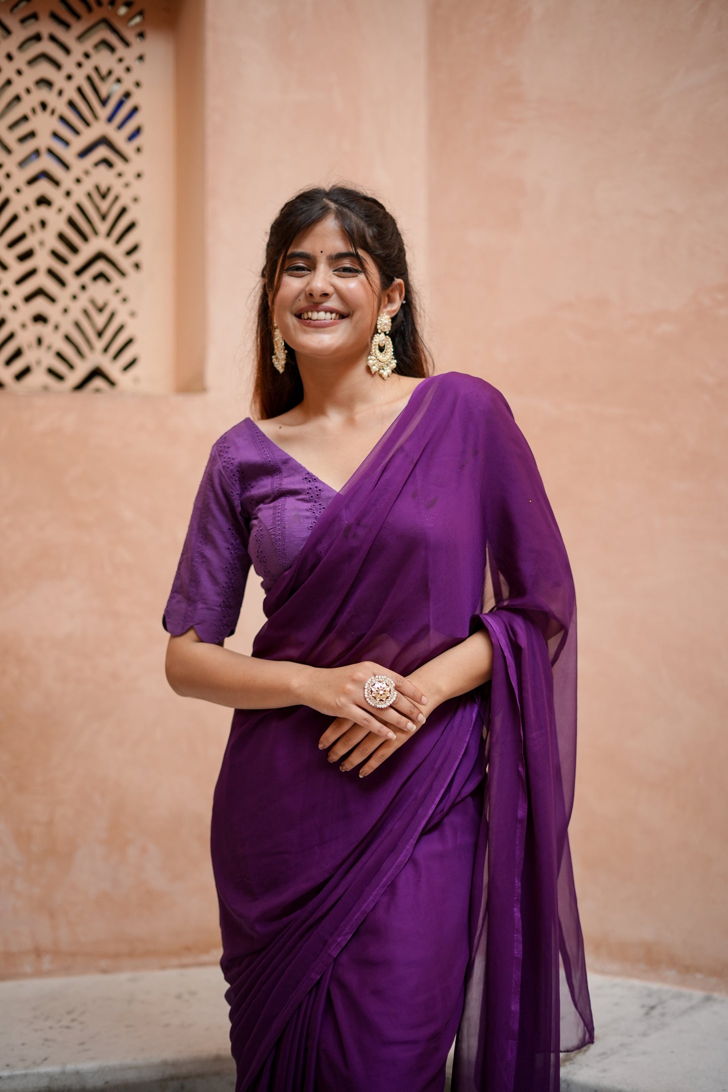 Purple Chiffon Saree with Schifli Blouse piece.