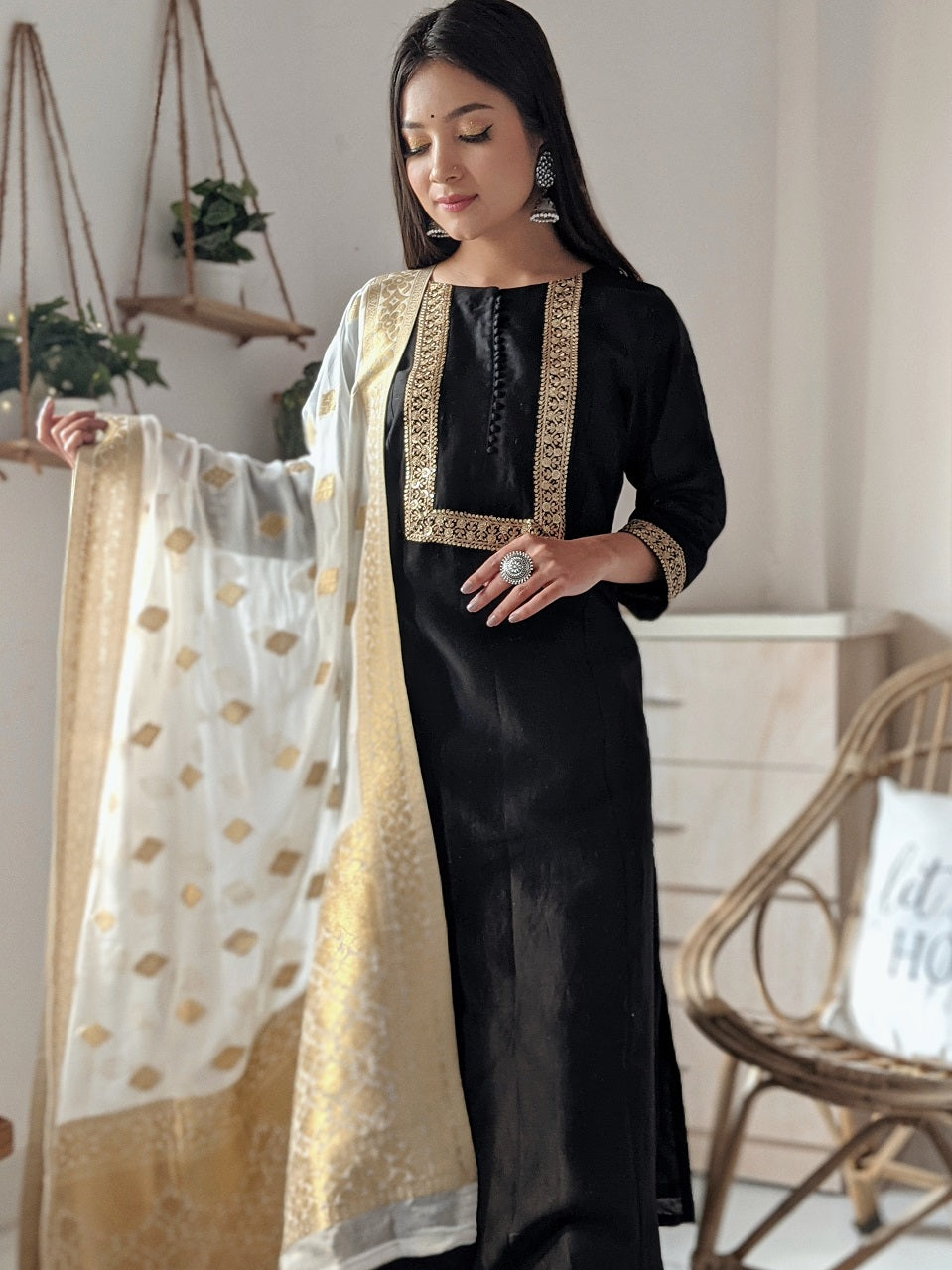 Black Silk Anarkali Kurta paired with pants.